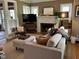 Comfortable living room with a fireplace, neutral tones, and ample natural light at 5786 N Delaware St, Indianapolis, IN 46220