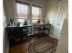 Cozy sitting room featuring hardwood floors and two shelving units at 5786 N Delaware St, Indianapolis, IN 46220
