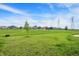 Expansive backyard featuring lush lawn and a view of the surrounding neighborhood at 5812 Flat Hill Dr, Indianapolis, IN 46239