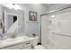 Modern bathroom features a glass-enclosed shower and sleek vanity with white countertop and basin sink at 5812 Flat Hill Dr, Indianapolis, IN 46239