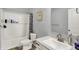 This bathroom includes a sleek vanity, a toilet, and a shower/tub with decorative curtain at 5812 Flat Hill Dr, Indianapolis, IN 46239