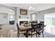 Elegant dining room with wood table set, view of the fireplace and living room at 5812 Flat Hill Dr, Indianapolis, IN 46239