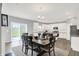Inviting dining area with a wood table set and a view of the open kitchen at 5812 Flat Hill Dr, Indianapolis, IN 46239