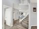 Spacious foyer with staircase and hardwood flooring offers a welcoming entrance and leads to various rooms in the home at 5812 Flat Hill Dr, Indianapolis, IN 46239