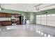 Spacious garage with epoxy flooring, kitchen area and plenty of room for storage at 5812 Flat Hill Dr, Indianapolis, IN 46239