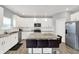 Bright kitchen features stainless steel appliances, granite countertops, and white cabinetry at 5812 Flat Hill Dr, Indianapolis, IN 46239