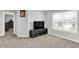 Bright living room featuring a window, media center, and gray walls with plush carpeting at 5812 Flat Hill Dr, Indianapolis, IN 46239