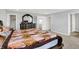 Main bedroom with a carpeted floor, decorative bedding, and dark wood furniture at 5812 Flat Hill Dr, Indianapolis, IN 46239