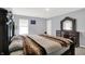 This comfortable main bedroom features plush carpet, a large bed, and a dresser with elegant decor at 5812 Flat Hill Dr, Indianapolis, IN 46239
