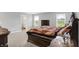 Main bedroom with a carpeted floor, decorative bedding, and dark wood furniture at 5812 Flat Hill Dr, Indianapolis, IN 46239