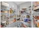 Organized walk-in pantry with wire shelving, showcasing ample storage space for food and kitchen essentials at 5812 Flat Hill Dr, Indianapolis, IN 46239