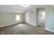 Bedroom with plush carpet, two windows, and freshly painted walls at 590 W Washington St, Martinsville, IN 46151
