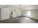 Spacious bedroom featuring neutral carpet, trim and paint, and natural light from the window at 590 W Washington St, Martinsville, IN 46151