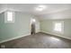 Bedroom with plush carpet, two windows, and freshly painted walls at 590 W Washington St, Martinsville, IN 46151