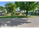 Street view of a charming brick home surrounded by lush green grass and mature shade trees at 590 W Washington St, Martinsville, IN 46151