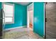 Bright kitchen boasts unique barn door, stainless steel refrigerator, and tiled floor at 590 W Washington St, Martinsville, IN 46151