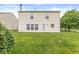 Spacious, fenced backyard featuring a lush lawn and mature trees at 6259 Teacup Dr, Indianapolis, IN 46235