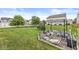 Expansive backyard with seating, mature trees and a lush green lawn at 6259 Teacup Dr, Indianapolis, IN 46235