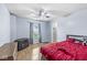Well-lit bedroom with hardwood floors, a window view, and an ensuite bathroom access at 6259 Teacup Dr, Indianapolis, IN 46235