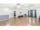 Spacious bonus room with hardwood floors, ceiling fans, curtains, and neutral walls at 6259 Teacup Dr, Indianapolis, IN 46235