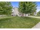Traditional home with a spacious front yard, mature trees, and a welcoming entrance at 6259 Teacup Dr, Indianapolis, IN 46235