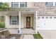 Charming front porch with a decorative wooden door, sidelights, and a welcoming entrance at 6259 Teacup Dr, Indianapolis, IN 46235