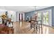 Bright living room with hardwood floors, stylish decor, and a view of the front yard at 6259 Teacup Dr, Indianapolis, IN 46235