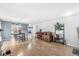 Spacious living room featuring wood floors, modern lighting, and open access to the kitchen at 6259 Teacup Dr, Indianapolis, IN 46235