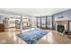 Open concept living room and kitchen featuring hardwood floors, fireplace, and stainless steel appliances at 6259 Teacup Dr, Indianapolis, IN 46235