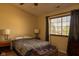 This comfortable bedroom features a cozy bed, window, and side tables for a relaxing retreat at 6585 Dunsdin Dr, Plainfield, IN 46168