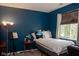 Cozy bedroom with neutral bedding and window at 6585 Dunsdin Dr, Plainfield, IN 46168