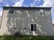 Exterior back showcasing siding, and multiple windows on a sunny day at 6585 Dunsdin Dr, Plainfield, IN 46168