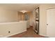 Hallway with neutral walls, lighting fixtures, and closets for storage at 6585 Dunsdin Dr, Plainfield, IN 46168