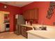 Contemporary kitchen with stainless steel appliances, a modern sink, and a view into the laundry area at 6585 Dunsdin Dr, Plainfield, IN 46168