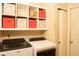 Bright laundry room with modern washer and dryer and lots of storage at 6585 Dunsdin Dr, Plainfield, IN 46168