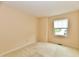 Cozy bedroom features carpet, a large window providing natural light, and neutral paint at 6965 Steinmeier W Dr, Indianapolis, IN 46220