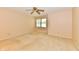 Neutral bedroom featuring a ceiling fan and a window at 6965 Steinmeier W Dr, Indianapolis, IN 46220