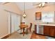 Cozy breakfast nook featuring a table, two chairs, and natural lighting by a window and sliding doors at 6965 Steinmeier W Dr, Indianapolis, IN 46220