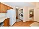 Functional laundry area with modern washer and dryer conveniently located near the kitchen and dining area at 6965 Steinmeier W Dr, Indianapolis, IN 46220