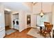 Bright laundry area with modern washer and dryer, adjacent to a dining space with table and chairs at 6965 Steinmeier W Dr, Indianapolis, IN 46220