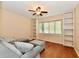Modern living room with hardwood floors, built-in shelving, and comfortable seating, creating an inviting and stylish space at 6965 Steinmeier W Dr, Indianapolis, IN 46220