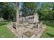 Spacious backyard with fire pit and a deck that is perfect for relaxation and gatherings at 7141 E Pleasant Run Pkwy S Dr, Indianapolis, IN 46219