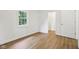 Bright bedroom with vinyl floors, a window with natural light and closet at 7141 E Pleasant Run Pkwy S Dr, Indianapolis, IN 46219