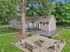 Single Gathering home with a fenced backyard, a deck and a fire pit at 7141 E Pleasant Run Pkwy S Dr, Indianapolis, IN 46219