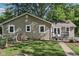 The home's exterior with a fenced yard, deck, and attractive tan siding at 7141 E Pleasant Run Pkwy S Dr, Indianapolis, IN 46219