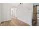 Well-lit hallway featuring hardwood floors, modern finishes, and an inviting atmosphere at 7141 E Pleasant Run Pkwy S Dr, Indianapolis, IN 46219
