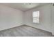 This bedroom has neutral gray carpet, and a window letting in plenty of light at 7501 Firecrest Ln, Camby, IN 46113