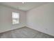Cozy bedroom with neutral carpet, window, and pristine white walls for versatile decor options at 7501 Firecrest Ln, Camby, IN 46113