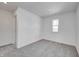 Comfortable bedroom with neutral carpet, a window, and an adjoining doorway to another room at 7501 Firecrest Ln, Camby, IN 46113