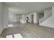 Spacious open concept living space featuring the living room, kitchen, and staircase at 7501 Firecrest Ln, Camby, IN 46113